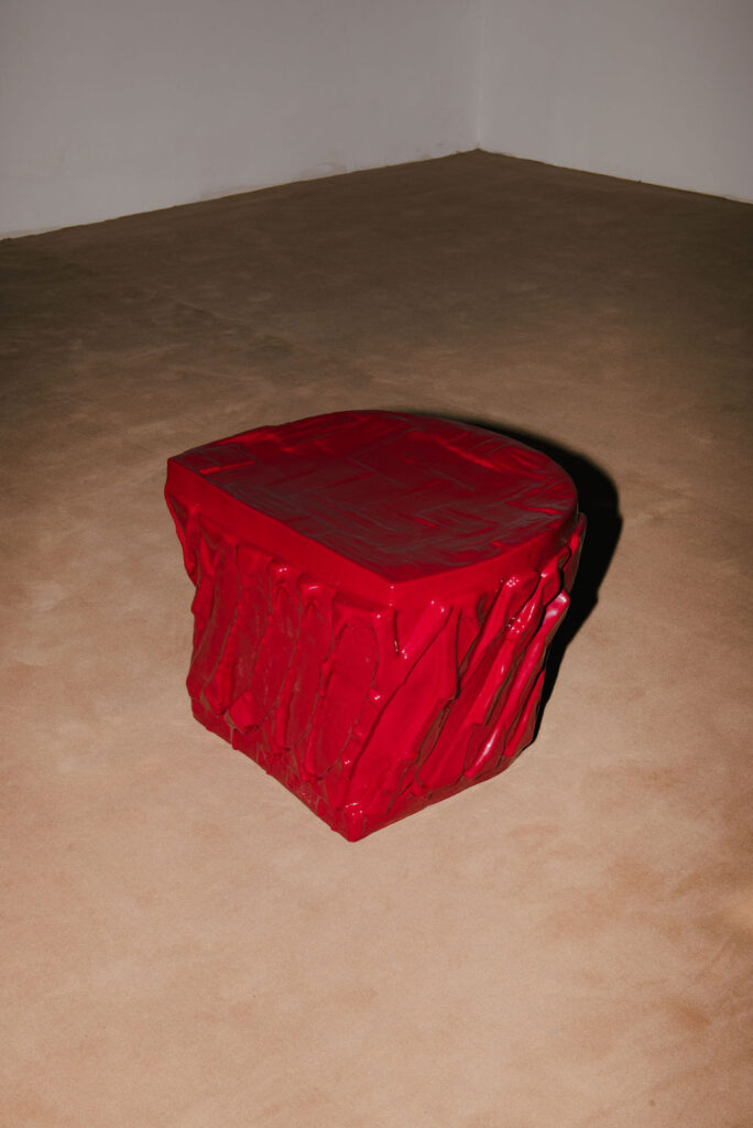 A red cast of the space under my chair, n.d.